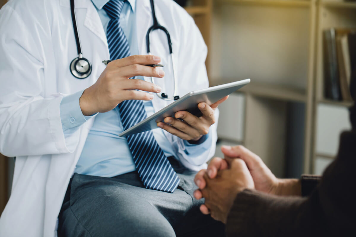 Professional psychologist counseling to male patient stock image